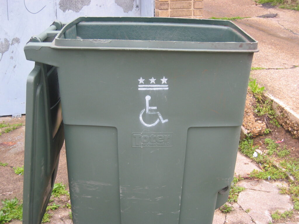 handicap trash can sign